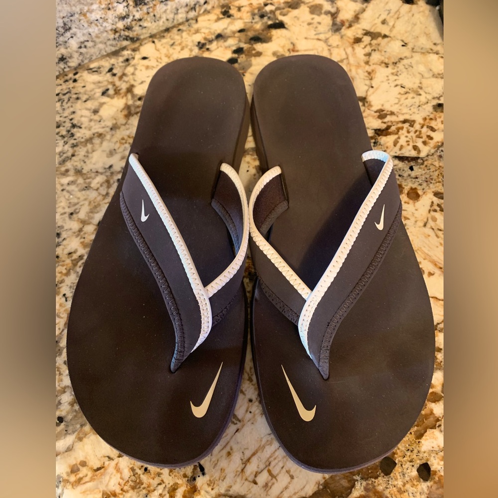 Nike Brown and white flip flops size 8